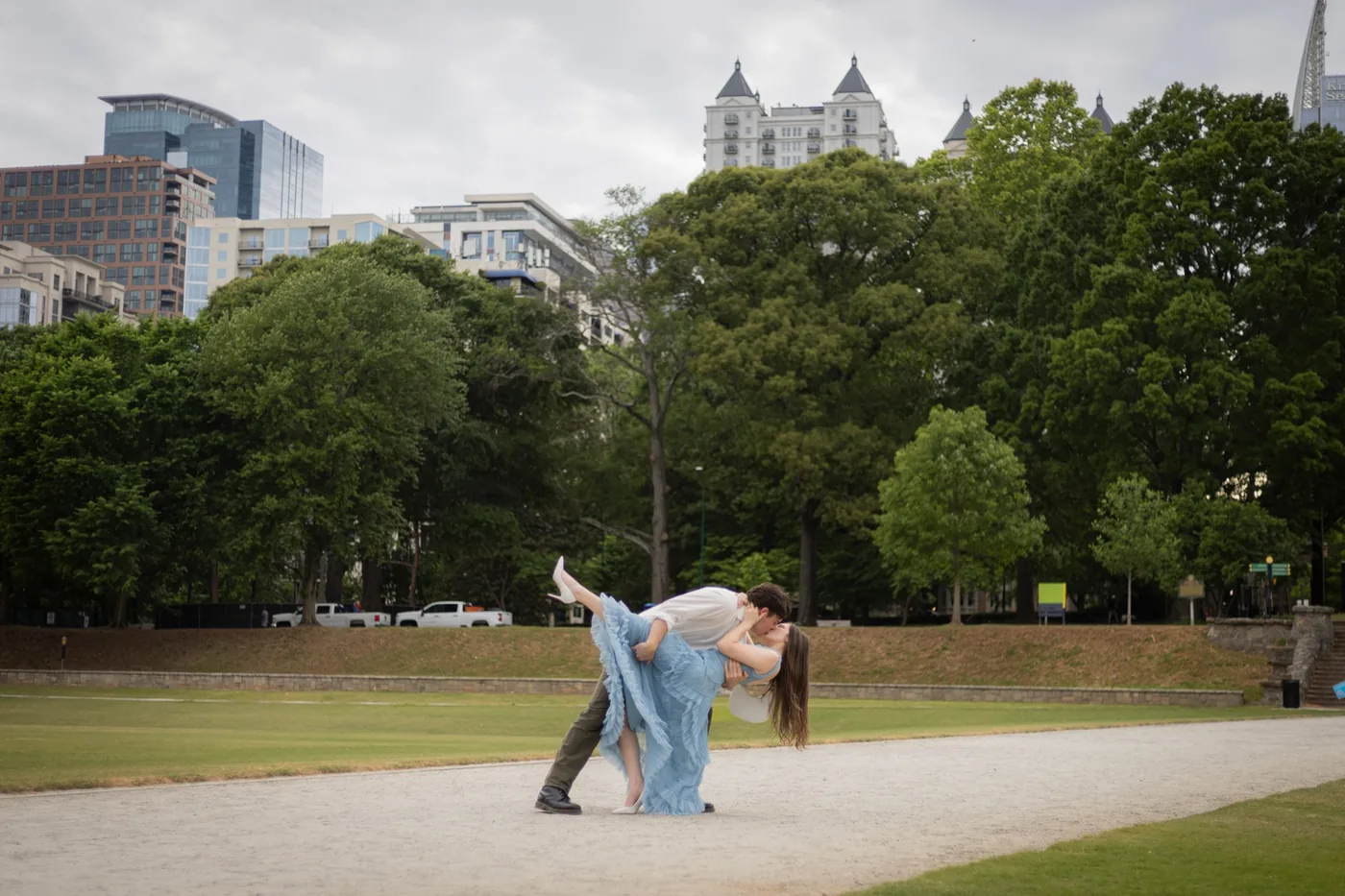 Alyse and Andrew dip kiss in Piedmont Park